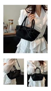 Vue détaillée du sac seau noir en cuir avec nœud papillon et bandoulière amovible