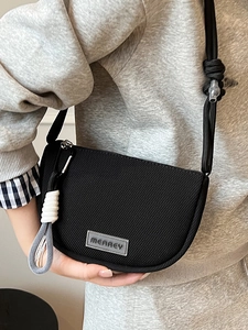 Black minimalist mesh saddle crossbody bag with adjustable rope strap and Merrey logo