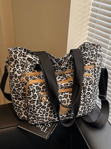 Stylish large capacity leopard print tote bag with multiple pockets and adjustable strap