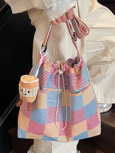 Colorful striped canvas tote bag with drawstring closure and cute plush pendant