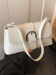 Minimalist cream white underarm shoulder bag with a silver round buckle and oil wax leather