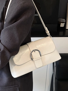Minimalist cream underarm bag with vintage faux leather texture and large silver ring buckle