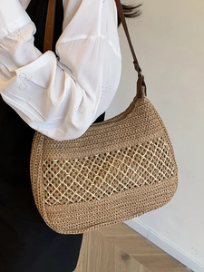 Woven straw shoulder bag with hollow diamond pattern and brown leather straps