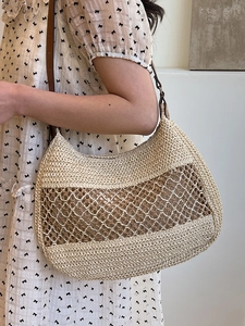 Hollow knit straw shoulder bag with dark brown leather strap for summer beach vacations