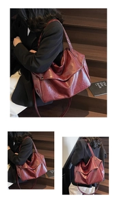 Detail view of burgundy leather tote bag with glossy finish and adjustable shoulder strap