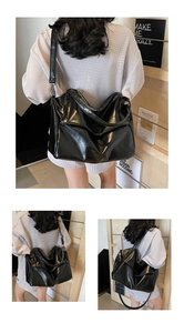 Detail view of large black hobo bag in soft polished PU leather with adjustable strap