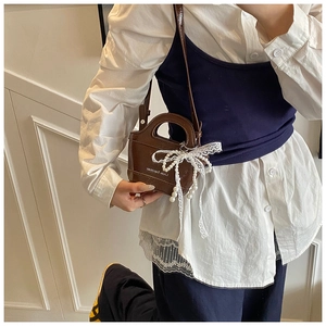Mini crossbody bag in dark brown leather with white lace pearl bow ribbon detail