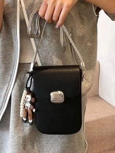Black lychee leather crossbody phone bag with silver chain and cute doll charm