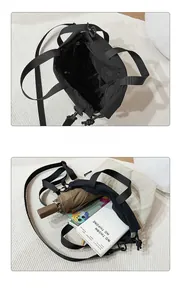 Internal view of black casual tote bag with drawstring closure and large storage capacity