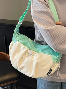 Minimalist crossbody dumpling bag in mint green and cream white color block style