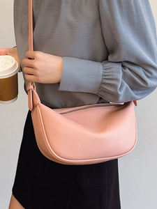 Pink crescent shoulder bag in lychee texture faux leather for casual urban commuting