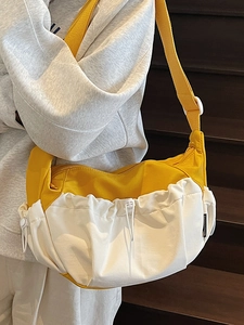 Fashionable yellow and white crossbody dumpling bag with drawstring and wide strap