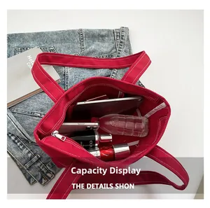 Top view of red canvas tote bag showing large capacity for tablet and daily essentials