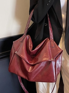 Vintage burgundy oil wax leather tote bag with wide strap for stylish women commuters