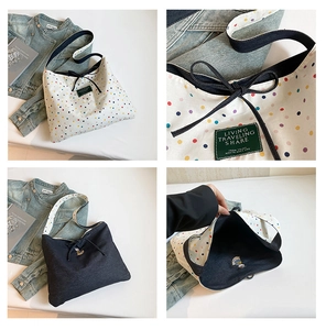 Detail of reversible canvas tote with polka dots, animal embroidery, and drawstring closure