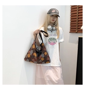 Detailed macro view of retro geometric ethnic pattern on durable canvas tote bag