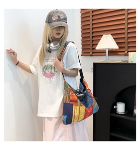 Detailed view of the drawstring closure on a colorful ethnic patchwork tote bag