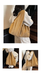 Detail view of khaki canvas tote bag showing durable fabric texture and large capacity