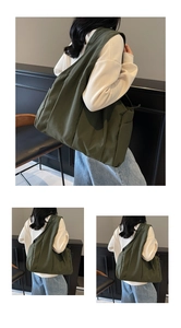 Detail view of large olive green canvas tote bag with side pocket and spacious interior