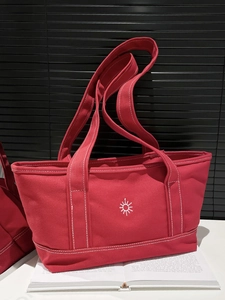 Japanese style red canvas tote bag with white sun pattern and contrast stitching