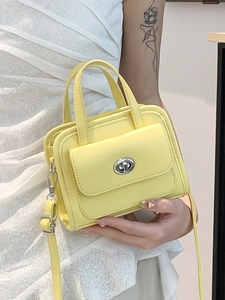 Mini borsa a mano gialla moderna con chiusura a scatto argento e tracolla donna