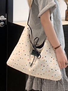 Ethnic style canvas tote bag with colorful polka dots and green travel share label