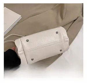 Detailed macro view of white lychee pattern leather base with silver metal rivets