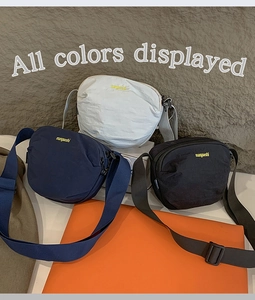 Nylon crossbody bags in navy, grey, and black with manyueshi embroidery detail