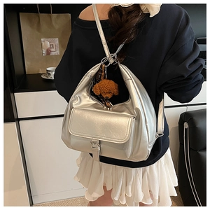 Silver metallic moon tote bag with teddy charm shown on shoulder for daily fashion style