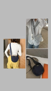 Detail of nylon crossbody bag with adjustable wide strap and yellow logo embroidery
