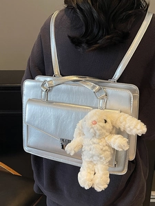 Chic silver metallic rectangular backpack and handbag with cute plush rabbit charm