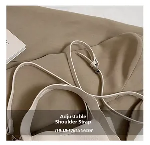 Close-up of adjustable strap detail and metal buckle on creamy white leather bucket bag