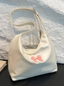 Minimalist cream white tote bag with pink bow embroidery and adjustable shoulder strap