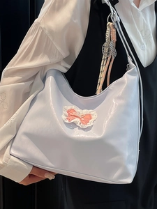 Chic light purple patent leather tote bag with lace bow and tennis racket charm