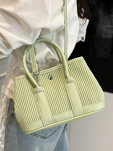 Chic light green pleated bucket bag for women with round handles and adjustable strap