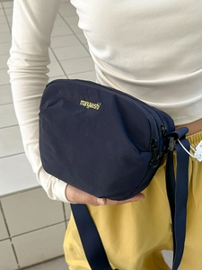 Blue nylon crossbody bag with yellow manyueshi logo and adjustable strap for daily use