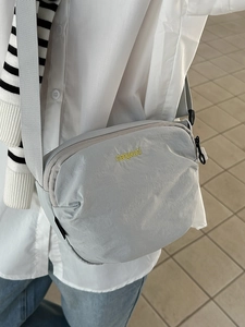 Japanese casual light gray nylon crossbody bag for men and women with yellow logo embroidery