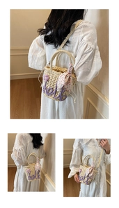 Detailed view of straw bag with hello embroidery, floral scarf and drawstring closure