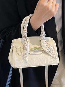Minimalist cream white leather handbag with silk scarf handle and metal twist lock