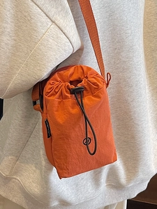 Fashionable orange nylon drawstring crossbody phone bag for women casual travel use