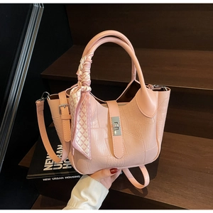 Close-up of pink stone pattern bucket bag with silk scarf handle and silver lock