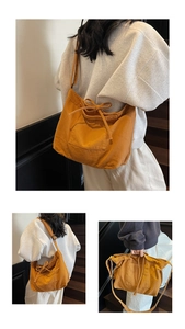 Detail view of mustard yellow canvas tote bag featuring a decorative bow and outer pocket