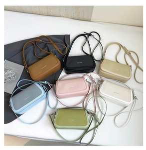 Detailed flat lay of chic textured crossbody bags in seven stylish pastel and neutral colors