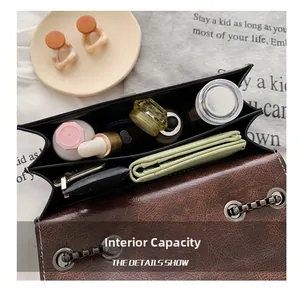 Internal capacity detail of vintage brown leather bag showing multi-layer compartments