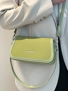 Avocado green minimalist crossbody bag with woven texture flap and metal logo