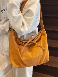 Japanese style mustard yellow canvas tote bag with drawstring detail and large front pocket
