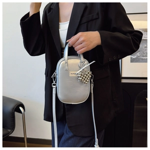 Chic silver metallic mini crossbody phone bag with beaded charm and top handle