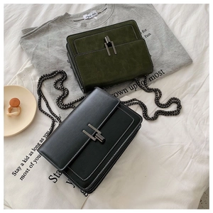 Detail of vintage Maillard-style square bags with metallic H-clasp and chain straps