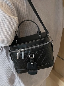 Elegant black box-style crossbody bag with quilted PU leather texture and top handle