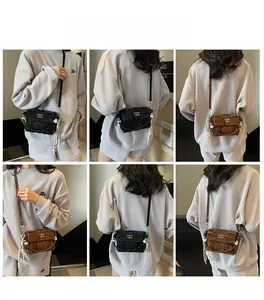 Detailed views of woven lattice small square handbags with pearl fringe charms in black and brown